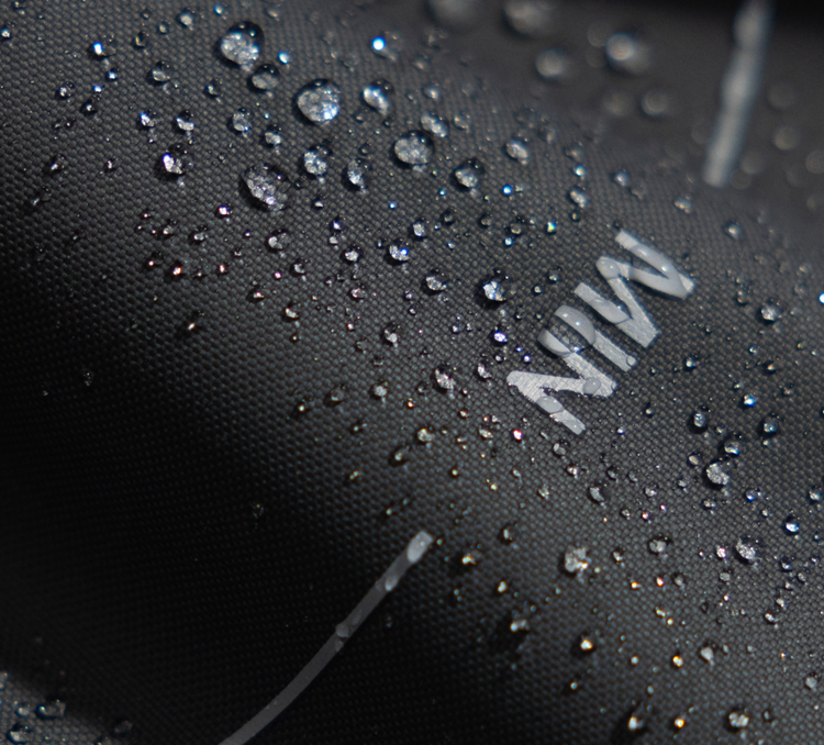 Petlibro PETLIBRO close-up of black waterproof fabric with water droplets; cat pet fountain, litter box, automatic feeder accessory detail